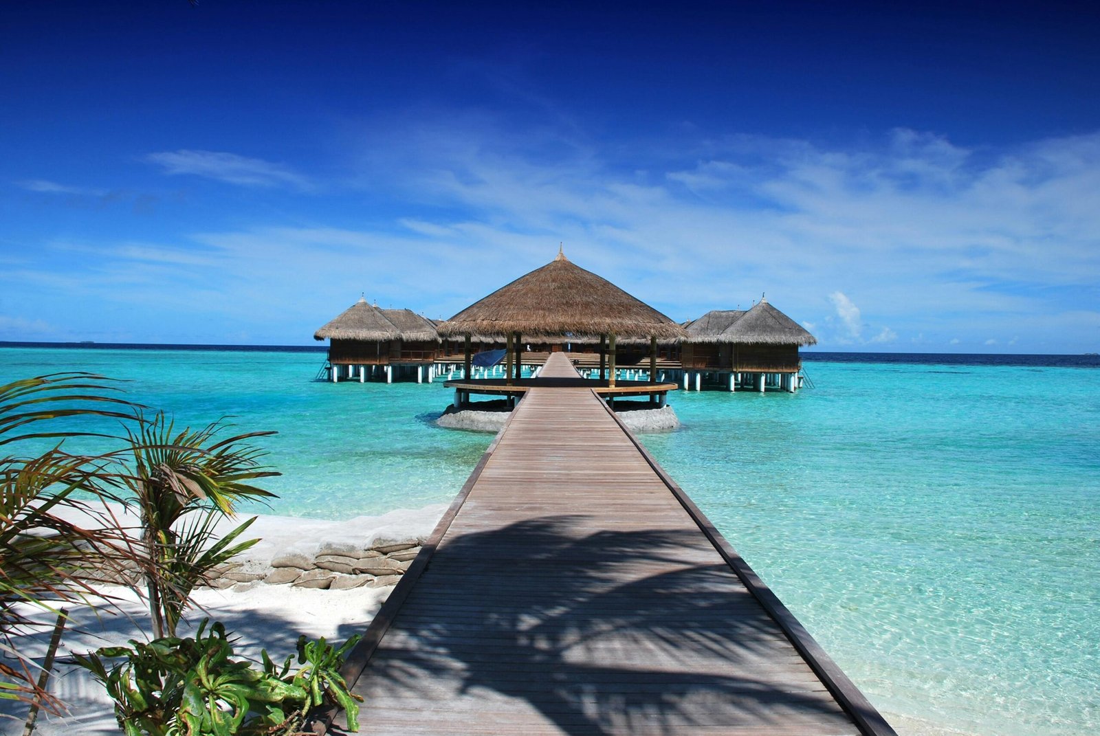 Ultimate tropical paradise beach destination with crystal-clear water and luxury resort for dream travel quests.