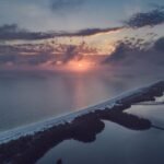 An aerial view of the stunning beaches of South Padre Island, Texas, at sunset, a perfect destination for your 2025 trip and one of the best things to do in SPI.