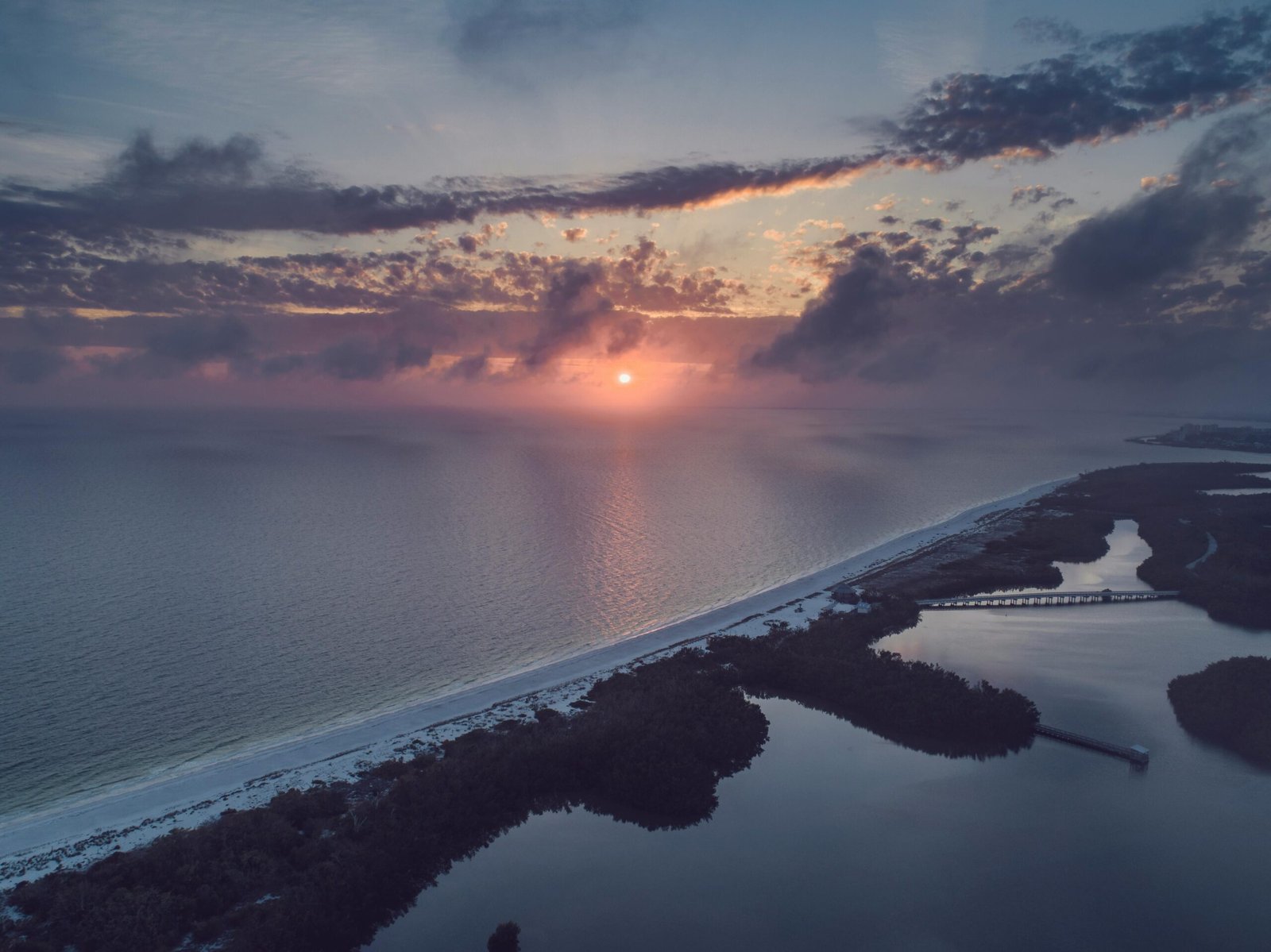 An aerial view of the stunning beaches of South Padre Island, Texas, at sunset, a perfect destination for your 2025 trip and one of the best things to do in SPI.