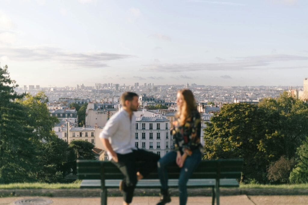 A traveler looks out over a vast city skyline at sunrise, symbolizing the journey to discover the most incredible cities in the world.