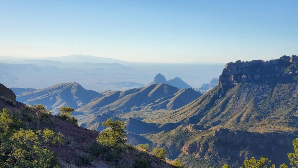 A scenic view of a vast Texas canyon at sunset, representing one of the best places to vacation in Texas for an adventure.