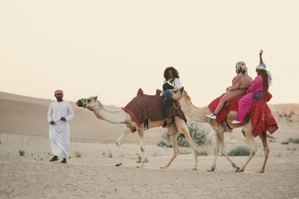Stunning evening desert safari in Dubai at sunset, featuring golden sand dunes and a sense of adventure.