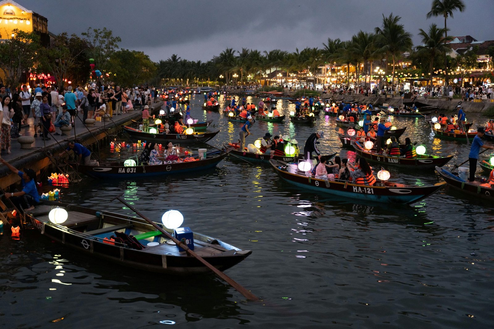 Vibrant, colorful lanterns light up the historic Ancient Town of Hoi An at night, a top city to visit in Vietnam for an unforgettable trip in 2025.