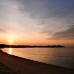 Scenic view of a beautiful East Coast USA beach with clear blue water, ideal for summer vacations and Atlantic coastline exploration.