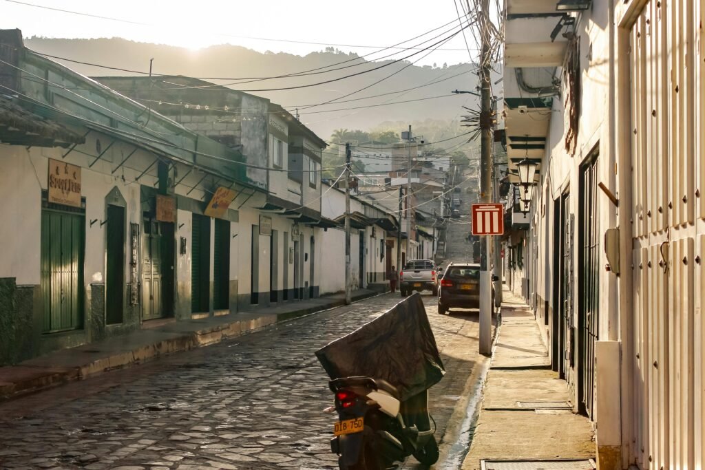 Charming cobblestone street in one of the world's prettiest cities at sunrise, showcasing beautiful architecture and a serene travel destination.