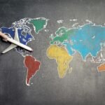 An inspiring image representing affordable world travel, showing a collage of diverse global landmarks or serene landscapes, symbolizing the dream of exploring cheap countries for memorable adventures and budget-friendly vacations.