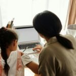 Parent and student using Infinite Campus Sequoia online portal to check grades and academic information.