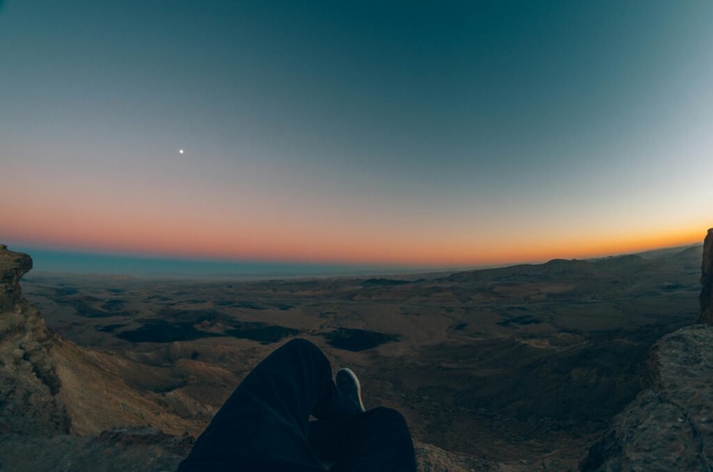 Panoramic view of the vast and diverse Negev Desert landscape in Israel, highlighting unique geological formations for adventure tours, hiking, and exploration.