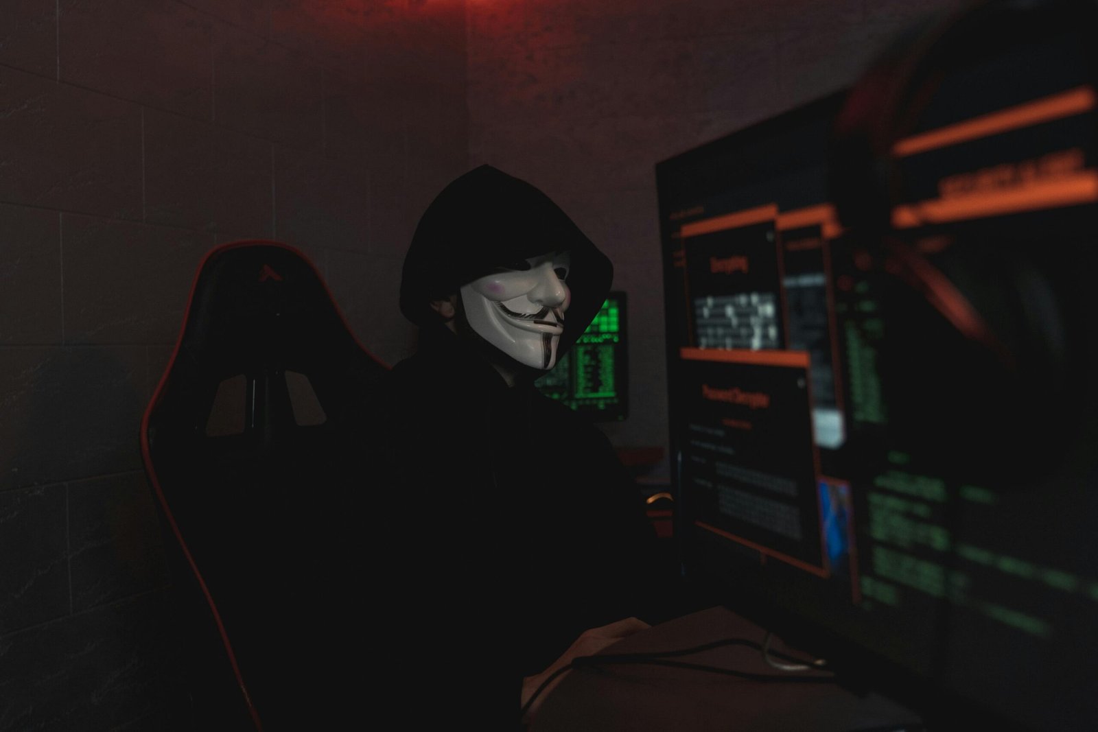 A person viewing a cybersecurity warning on a screen, illustrating the malware and phishing risks of searching for 'ooaris discord nude' content.