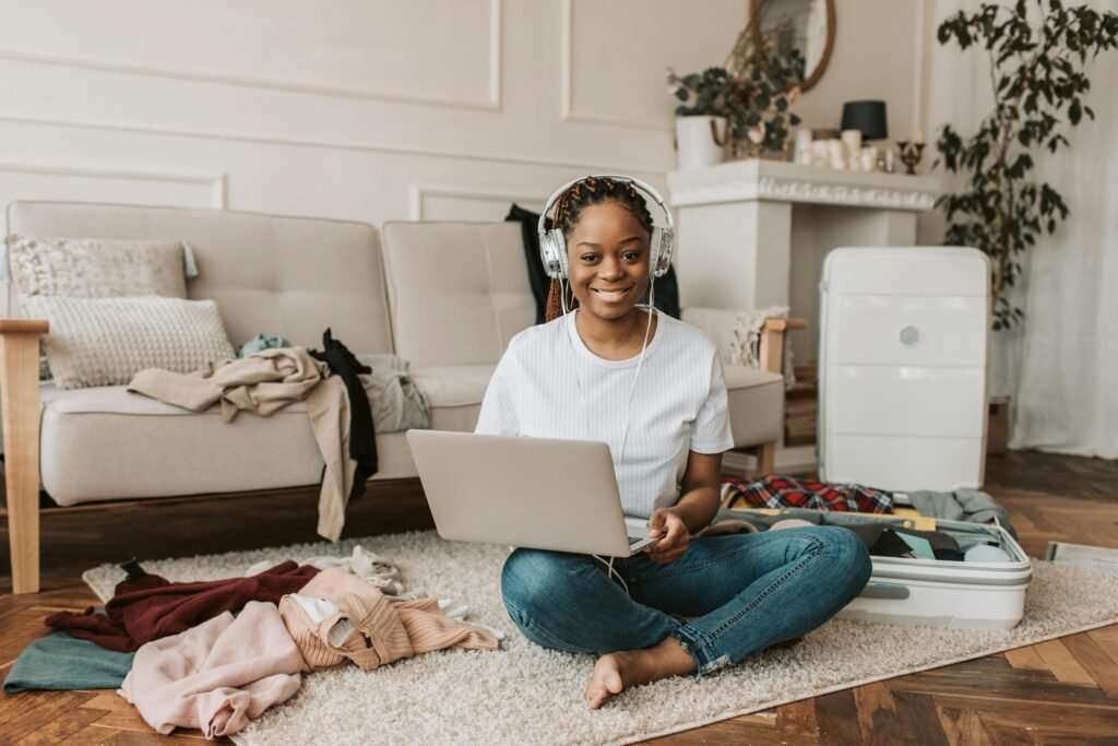 A person using a laptop to explore the travel web, easily planning and booking a trip online from the comfort of their couch.