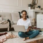 A person using a laptop to explore the travel web, easily planning and booking a trip online from the comfort of their couch.