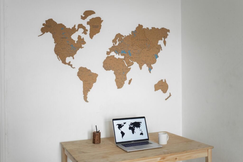 Professional travel agent using digital itinerary builder software on a laptop for efficient trip planning and enhanced client satisfaction.