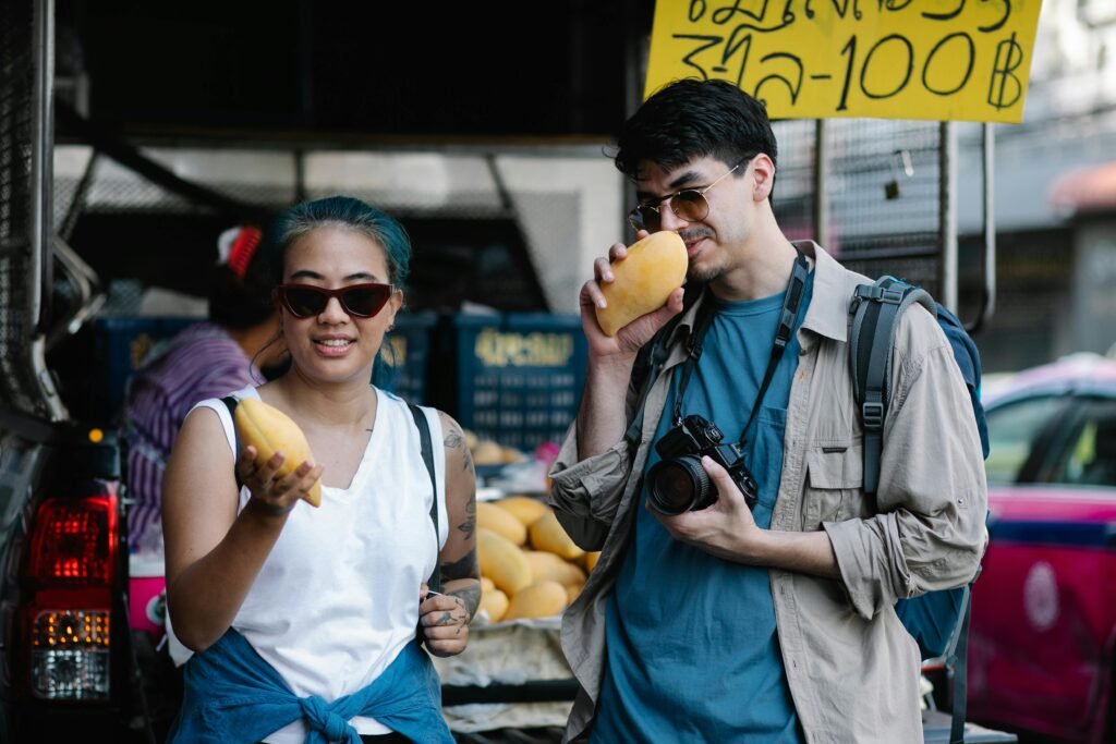 Budget traveler enjoying an authentic local market experience, illustrating affordable travel to the world's cheapest countries and cultural immersion.