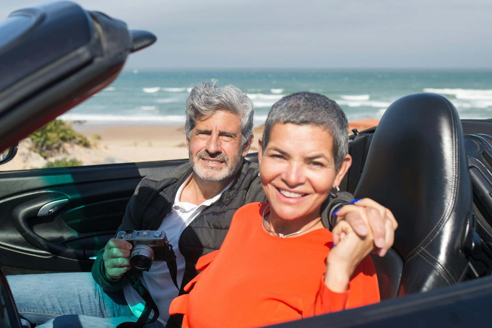Happy travelers enjoying a relaxed holiday, secure with Sainsbury's travel insurance covering medical emergencies, trip cancellation, and lost baggage for complete peace of mind.